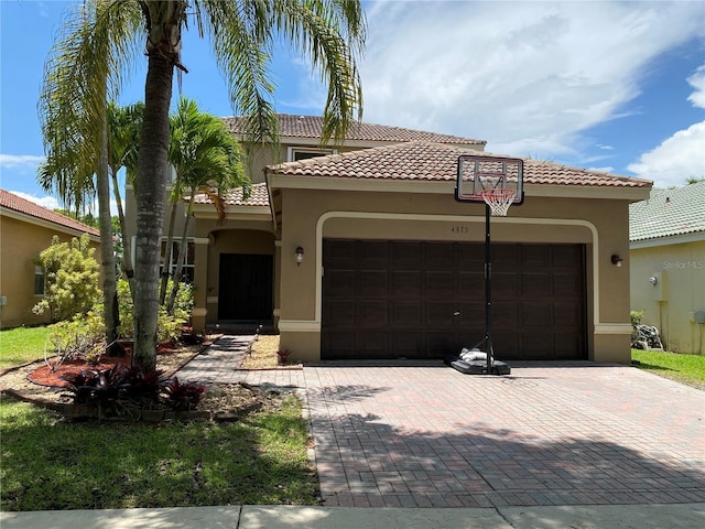 4375 Foxtail Ln, Weston, FL 33331 - mediterranean / spanish-style house with a garage, stucco siding, decorative driveway, and a tile roof