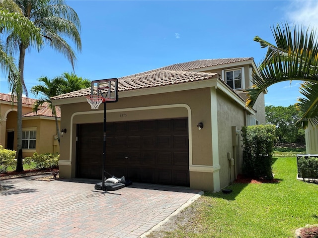 4375 Foxtail Ln, Weston, FL 33331 - view of front of house featuring stucco siding, an attached garage, a front yard, and a tile roof