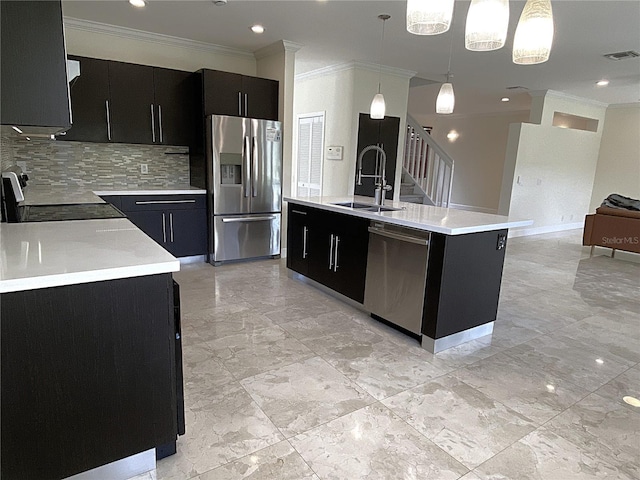 4375 Foxtail Ln, Weston, FL 33331 - kitchen with stainless steel appliances, dark cabinets, ornamental molding, light countertops, and decorative backsplash