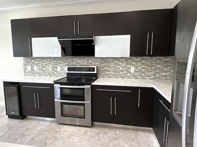 4375 Foxtail Ln, Weston, FL 33331 - kitchen featuring appliances with stainless steel finishes, dark cabinetry, beverage cooler, light countertops, and ornamental molding