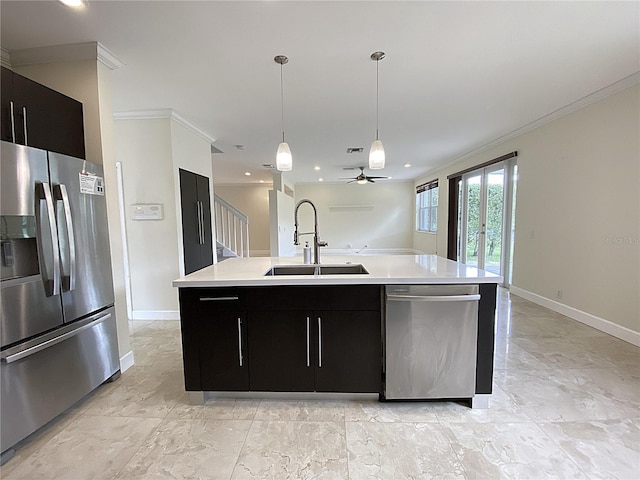 4375 Foxtail Ln, Weston, FL 33331 - kitchen featuring stainless steel appliances, dark cabinets, ornamental molding, light countertops, and an island with sink