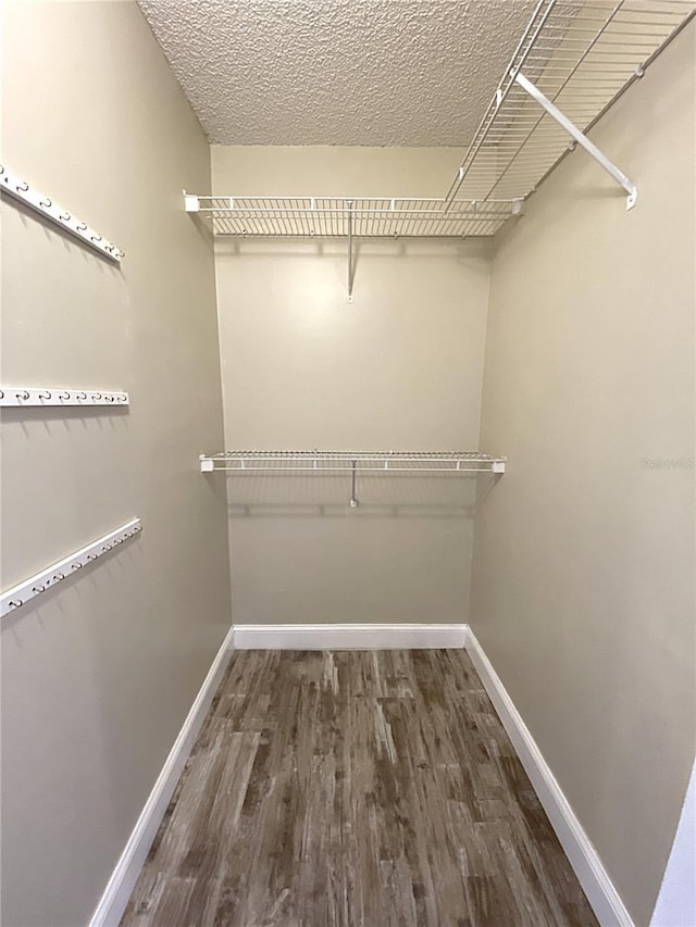 4375 Foxtail Ln, Weston, FL 33331 - walk in closet featuring wood finished floors