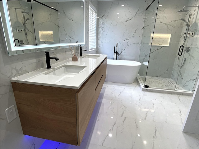 4375 Foxtail Ln, Weston, FL 33331 - full bath featuring a marble finish shower, marble finish floors, double vanity, stone wall, and a freestanding bath