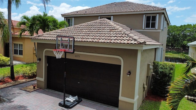4375 Foxtail Ln, Weston, FL 33331 - view of property exterior featuring stucco siding and a tile roof