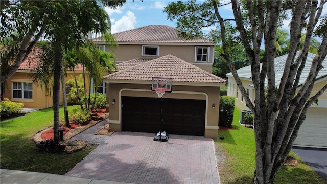 4375 Foxtail Ln, Weston, FL 33331 - mediterranean / spanish house with stucco siding, an attached garage, decorative driveway, a front lawn, and a tiled roof