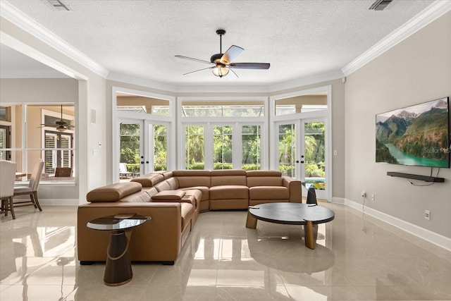 8800 Torey Pines Ter, Orlando, FL 32819 - living area with french doors, a ceiling fan, ornamental molding, and a textured ceiling