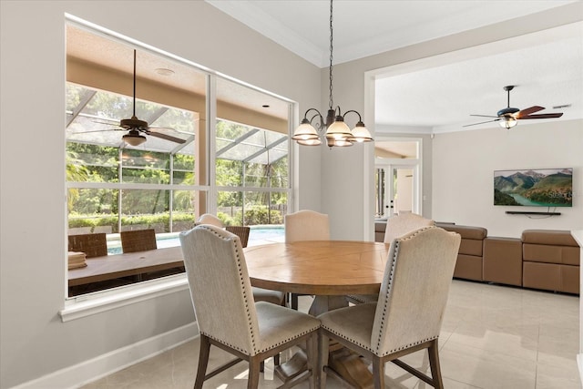 8800 Torey Pines Ter, Orlando, FL 32819 - dining area featuring crown molding, ceiling fan, light tile patterned floors, and a chandelier