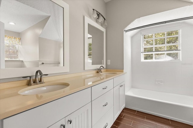8800 Torey Pines Ter, Orlando, FL 32819 - full bath featuring double vanity, wood tiled floors, and shower / washtub combination