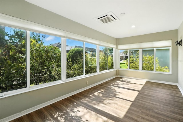 2895 Apache Ct, The Villages, FL 32163 - unfurnished sunroom featuring wood finished floors and recessed lighting