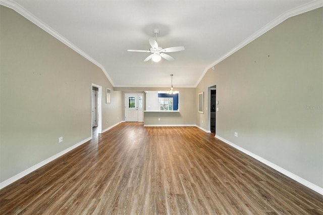 2895 Apache Ct, The Villages, FL 32163 - unfurnished living room with vaulted ceiling, dark wood-style floors, ceiling fan, crown molding, and a chandelier