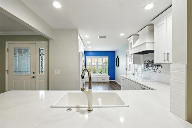 2895 Apache Ct, The Villages, FL 32163 - kitchen with recessed lighting, white cabinetry, light countertops, dark wood-style flooring, and ornamental molding