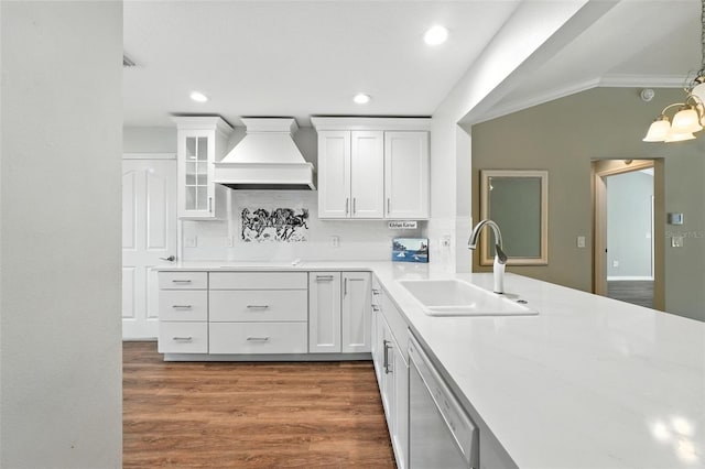 2895 Apache Ct, The Villages, FL 32163 - kitchen with custom exhaust hood, ornamental molding, backsplash, dishwasher, and white cabinetry