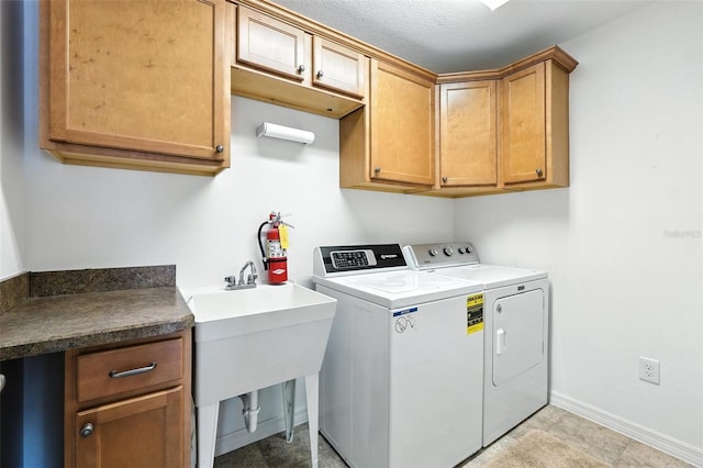 2895 Apache Ct, The Villages, FL 32163 - laundry room featuring independent washer and dryer and cabinet space