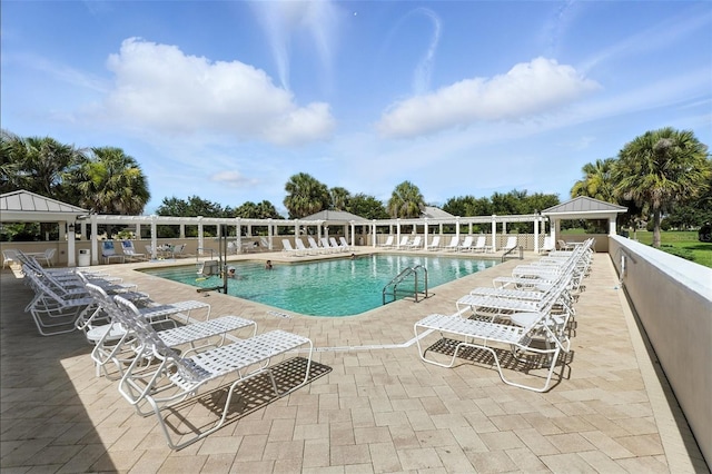 2895 Apache Ct, The Villages, FL 32163 - community pool with a gazebo and a patio area