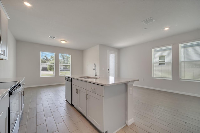 172 S Zuni Rd, Saint Cloud, FL 34771 - kitchen with black range with electric stovetop, dishwasher, wood tiled floors, white cabinetry, and recessed lighting