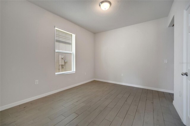 172 S Zuni Rd, Saint Cloud, FL 34771 - empty room featuring wood finished floors and baseboards