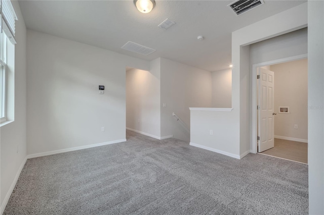 172 S Zuni Rd, Saint Cloud, FL 34771 - spare room featuring carpet floors and plenty of natural light