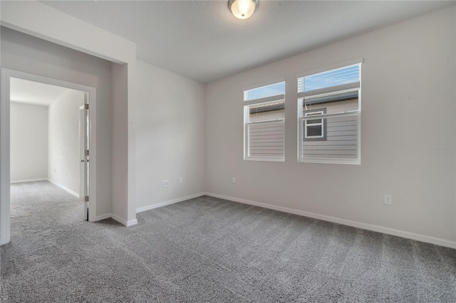 172 S Zuni Rd, Saint Cloud, FL 34771 - carpeted empty room featuring baseboards