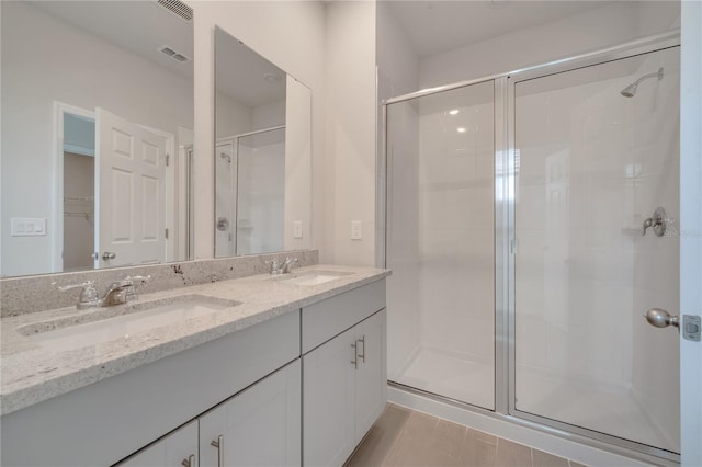 172 S Zuni Rd, Saint Cloud, FL 34771 - full bathroom with a stall shower, double vanity, and a walk in closet