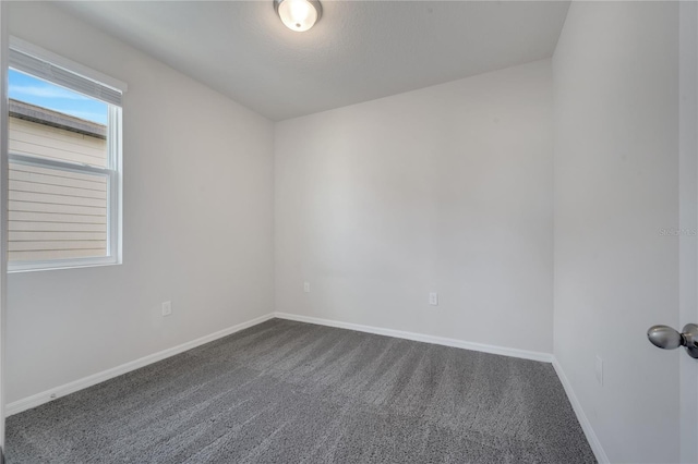 172 S Zuni Rd, Saint Cloud, FL 34771 - empty room with dark carpet and baseboards