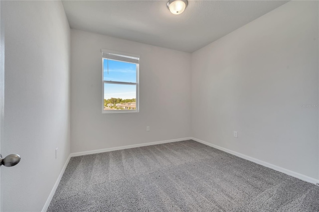 172 S Zuni Rd, Saint Cloud, FL 34771 - carpeted spare room with baseboards