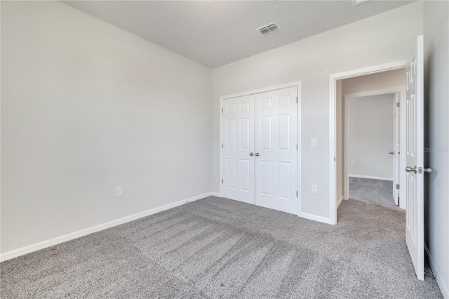 172 S Zuni Rd, Saint Cloud, FL 34771 - unfurnished bedroom featuring carpet floors and a closet