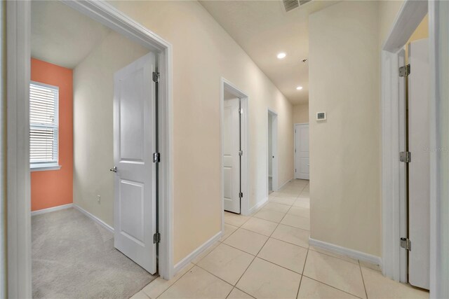 2601 Blowing Breeze Ave, Kissimmee, FL 34744 - hallway with recessed lighting and light tile patterned flooring