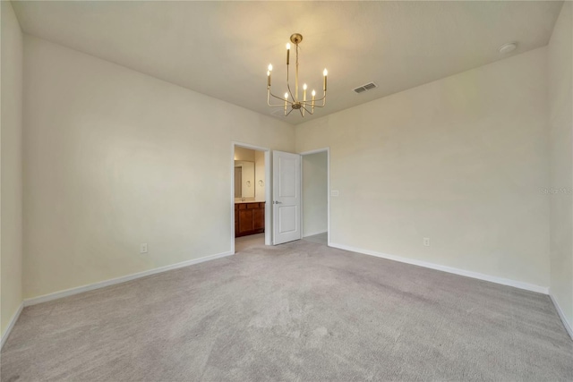 2601 Blowing Breeze Ave, Kissimmee, FL 34744 - empty room with a chandelier, light colored carpet, and a smoke detector