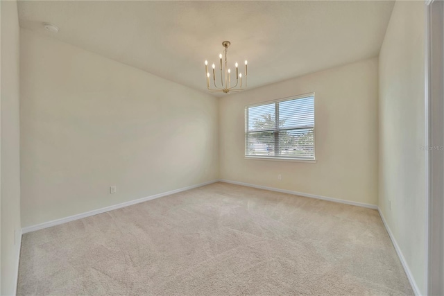 2601 Blowing Breeze Ave, Kissimmee, FL 34744 - carpeted spare room featuring a chandelier and a smoke detector
