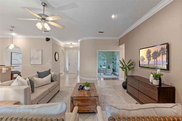 5102 Round Tree Ct, Orlando, FL 32819 - living area featuring crown molding, light tile patterned floors, ceiling fan, and arched walkways
