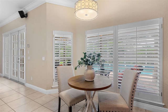 5102 Round Tree Ct, Orlando, FL 32819 - dining area with crown molding and light tile patterned floors