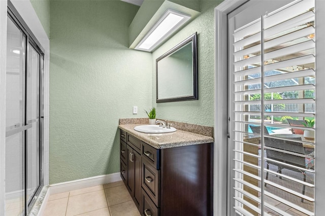 5102 Round Tree Ct, Orlando, FL 32819 - full bath featuring vanity, a textured wall, tile patterned floors, and tiled shower