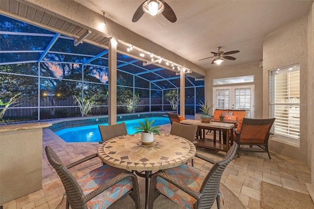 5102 Round Tree Ct, Orlando, FL 32819 - view of swimming pool featuring a ceiling fan, a fenced backyard, outdoor dining space, and a patio