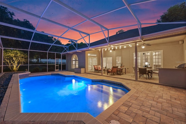 5102 Round Tree Ct, Orlando, FL 32819 - swimming pool with ceiling fan, a patio, french doors, and a lanai