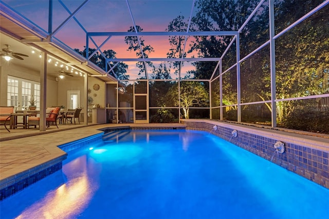 5102 Round Tree Ct, Orlando, FL 32819 - pool at dusk featuring ceiling fan, an outdoor pool, a patio, and french doors