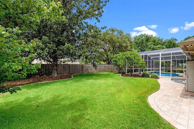 5102 Round Tree Ct, Orlando, FL 32819 - fenced backyard featuring glass enclosure and a patio area