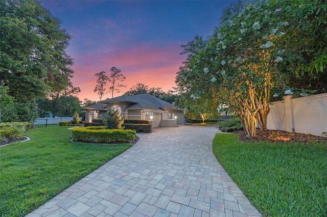 5102 Round Tree Ct, Orlando, FL 32819 - ranch-style home with decorative driveway and a garage