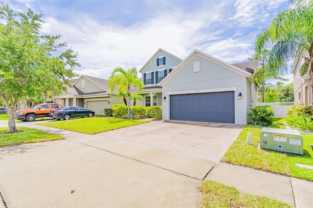 1639 Balsam Willow Trl, Orlando, FL 32825 - traditional home featuring decorative driveway, stucco siding, and an attached garage