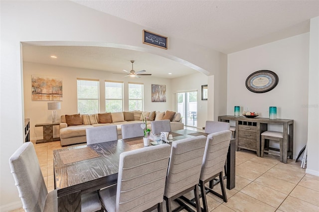 1639 Balsam Willow Trl, Orlando, FL 32825 - dining area featuring arched walkways, light tile patterned floors, and a ceiling fan