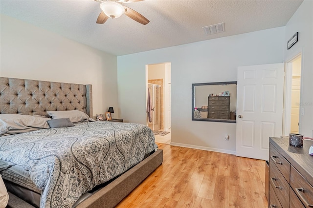 1639 Balsam Willow Trl, Orlando, FL 32825 - bedroom featuring light wood finished floors, ceiling fan, a textured ceiling, and connected bathroom
