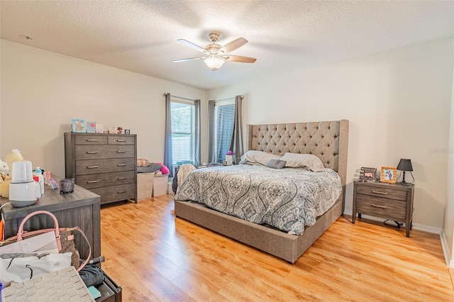 1639 Balsam Willow Trl, Orlando, FL 32825 - bedroom with light wood-type flooring, ceiling fan, and a textured ceiling