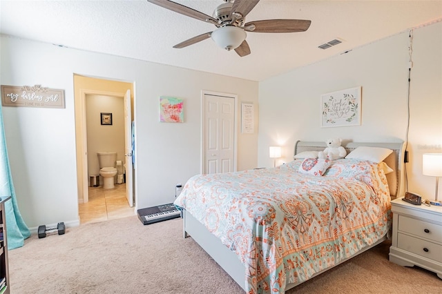 1639 Balsam Willow Trl, Orlando, FL 32825 - bedroom featuring light carpet, a closet, ceiling fan, and connected bathroom