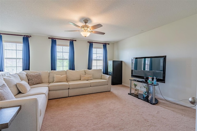 1639 Balsam Willow Trl, Orlando, FL 32825 - living room featuring carpet floors, ceiling fan, and a textured ceiling