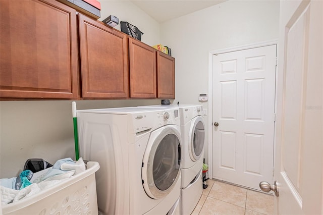 1639 Balsam Willow Trl, Orlando, FL 32825 - laundry room with cabinet space, independent washer and dryer, and light tile patterned floors