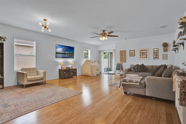 2216 Sequoia Way, Davenport, FL 33896 - living room featuring ceiling fan and wood finished floors