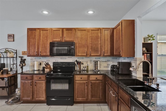 2216 Sequoia Way, Davenport, FL 33896 - kitchen featuring black appliances, dark stone countertops, backsplash, brown cabinetry, and recessed lighting