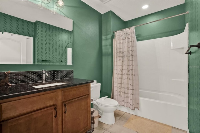 2216 Sequoia Way, Davenport, FL 33896 - bathroom featuring vanity, shower / bath combo with shower curtain, tile patterned floors, and decorative backsplash