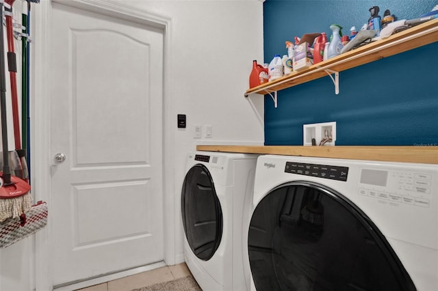 2216 Sequoia Way, Davenport, FL 33896 - laundry room featuring washing machine and dryer and light tile patterned floors