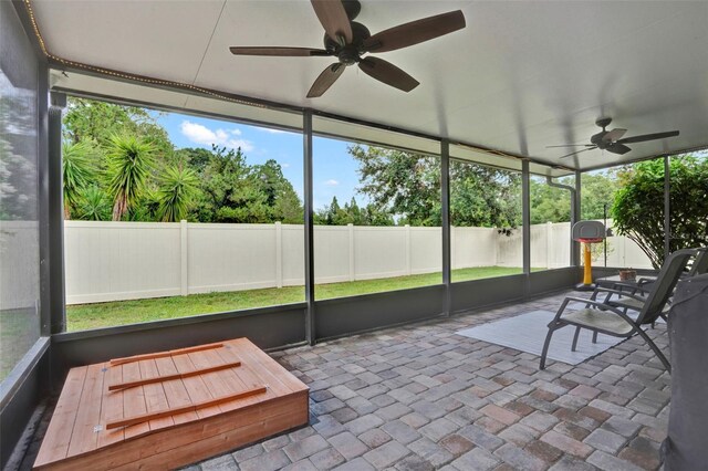 2216 Sequoia Way, Davenport, FL 33896 - unfurnished sunroom featuring a ceiling fan and healthy amount of natural light