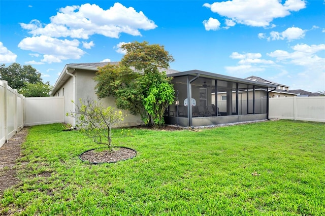 2216 Sequoia Way, Davenport, FL 33896 - back of house featuring a sunroom, a fenced backyard, and stucco siding